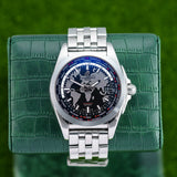 Front view of a Breitling Galactic Unitime WB3510 watch featuring a polished stainless steel case, 44mm size, with a sleek black dial and luminous hands.