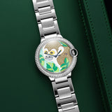 Front view of a Cartier Ballon Bleu W69012Z4 watch featuring a polished stainless steel case, 42mm size, blue hands, and a custom diamond monkey dial.