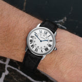 Front view of a Cartier Ronde Solo W6700255 watch featuring a stainless steel case, 36mm size, and a classic white dial with Roman numerals.
