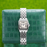 Front view of a Cartier Santos Demoiselle W25064Z5 watch featuring a stainless steel case and 20mm size, showcasing its elegant design and distinctive square dial.