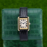 Front view of a Cartier Tank W5200002 watch featuring a yellow gold case, measuring 31mm by 24mm, with a classic rectangular design and Roman numeral dial.