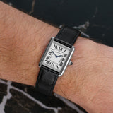 Front view of a Cartier Tank WSTA0030 watch featuring a stainless steel case, measuring 31mm x 24mm, with a classic rectangular design and a white dial.