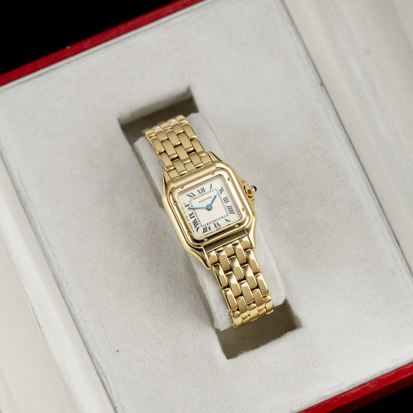 Front view of a Cartier Panthere 1070 2 watch featuring a polished yellow gold case, measuring 22mm by 30mm, with a classic design and elegant hour markers.
