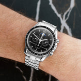 Front view of an Omega Speedmaster Moonphase 3576.50.00, featuring a stainless steel case, 42mm dial, and a black chronograph face with moonphase display.