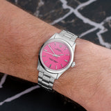 Front view of a Rolex Air King 5500 with a stainless steel case and 34mm dial, featuring a classic white face and luminous hour markers.