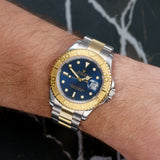 Front view of a Rolex Yacht-Master 16623, featuring a 40mm stainless steel and yellow gold case, with a blue dial and luminous hour markers.