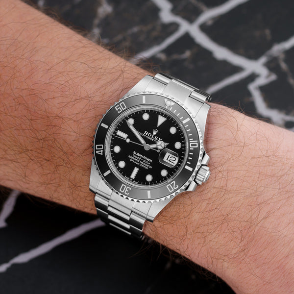 Front view of a Rolex Submariner Date 126610LN featuring a stainless steel case, 41mm size, black dial, and ceramic bezel.