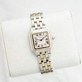 Front view of a Cartier Panthere Medium watch featuring a stainless steel and yellow gold case, 27mm size, showcasing a classic and elegant design.