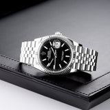 Front view of a Rolex Datejust 126234 watch, featuring a stainless steel case and a 36mm size, showcasing a classic design with a silver dial and diamond hour markers.