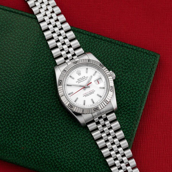 Front view of a Rolex Datejust Turnograph 116264 featuring a stainless steel case, 36mm size, and a silver dial with luminous markers.