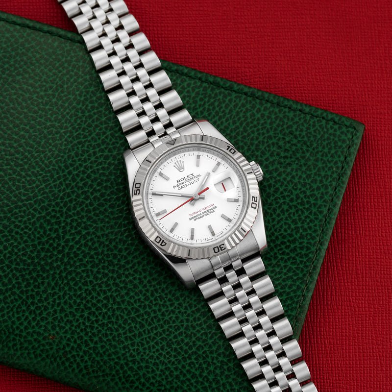 Front view of a Rolex Datejust Turnograph 116264 featuring a stainless steel case, 36mm size, and a silver dial with luminous markers.