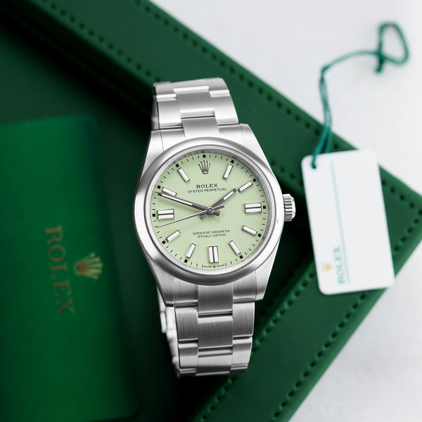 Front view of a Rolex Oyster Perpetual 134300 pistachio watch featuring a stainless steel case and a 41mm size, showcasing a classic design with a sleek dial and polished finish.