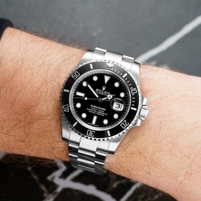 Front view of a Rolex Submariner Date 116610LN featuring a stainless steel case, 40mm size, black dial, and ceramic bezel.